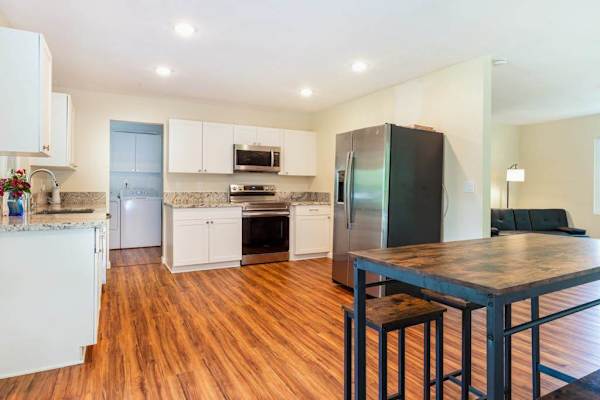 Large open air kitchen with upgraded appliances.