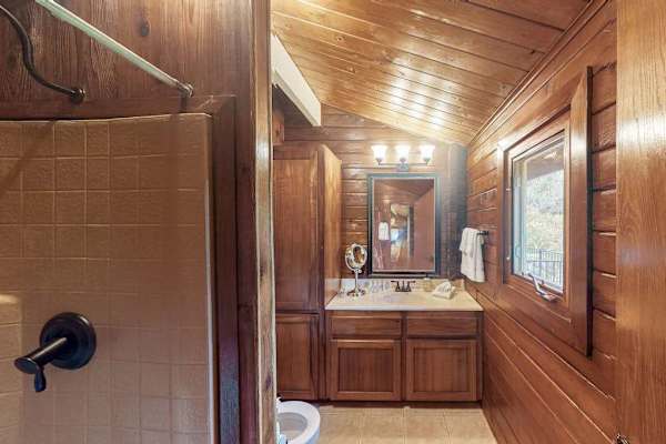 Full bathroom with a walk-in shower.