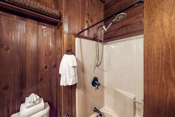 Full bathroom with a walk-in shower.