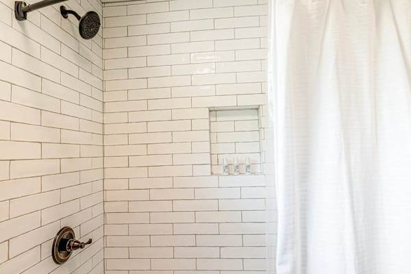 The Oasis Bath Shower with Subway Tile & Built-In Niche