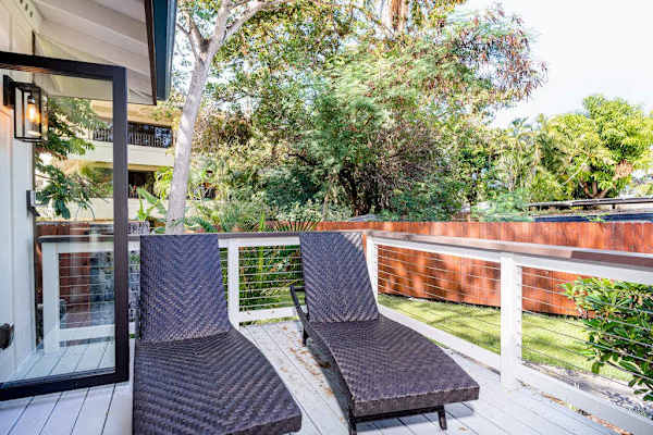 Private Outdoor Deck with Sun Loungers & Lush Garden Views