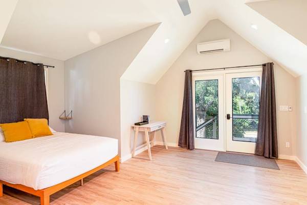 Queen Guest Suite with Private Balcony Access & Vaulted Ceilings