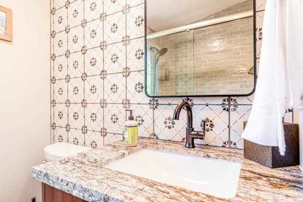 The Guest Retreat Bath Vanity with Patterned Accent Tile & Stone Top