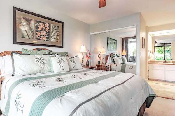 Spacious Primary Bedroom with Tropical Bedding & Mirrored Closets