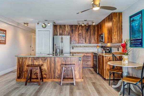 Warm & Inviting Kitchen Setup with Island Stools and Intimate Bistro Seating