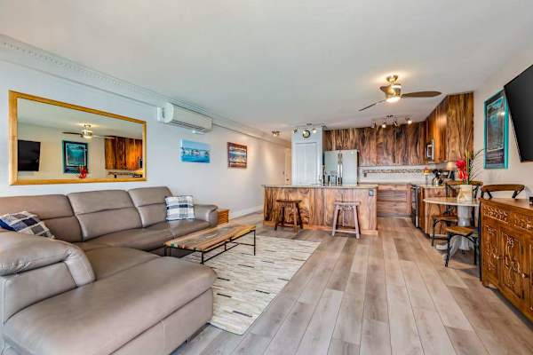 Spacious Open-Concept Layout Connecting Gourmet Kitchen to Living Area with AC