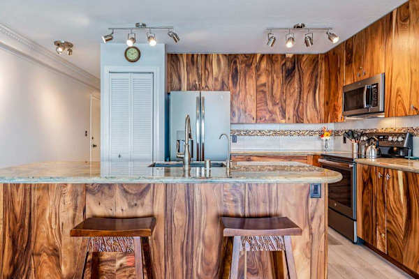 Elegant Kitchen Island View Showcasing Exotic Wood Grain Finish