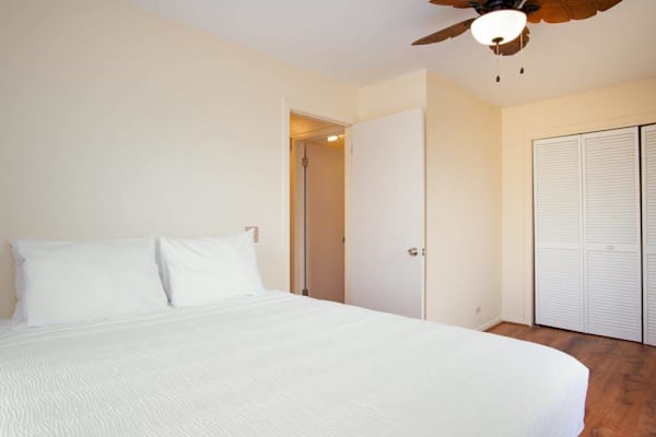 
Master bedroom with queen bed, ac and floor to window windows.
