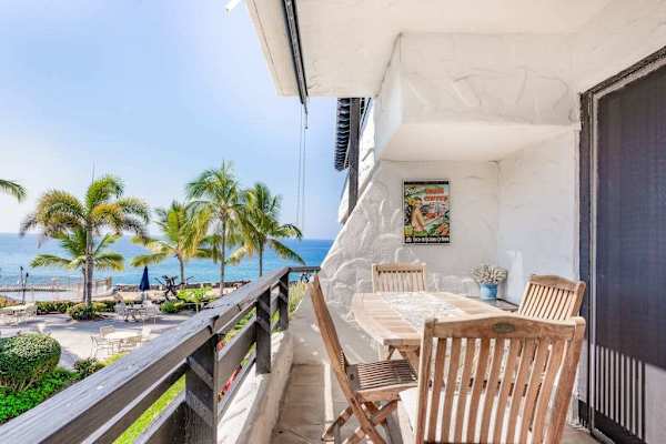 Covered Ocean View Lanai with Teak Dining Seating & Tropical Views