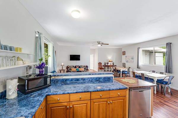 Large fully stocked kitchen open to the living and dining room so that you can always stay with your company.