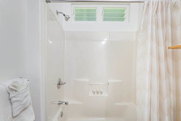 Full bathroom with tub/shower combo.