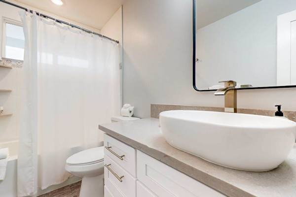 Guest bedroom with tub/shower combo.
