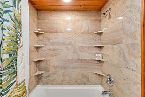 Master bathroom with lots of counter space and a tub/shower combo. 