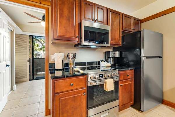 Well equipped kitchen with modern stainless steel appliances and new maple cabinetry.