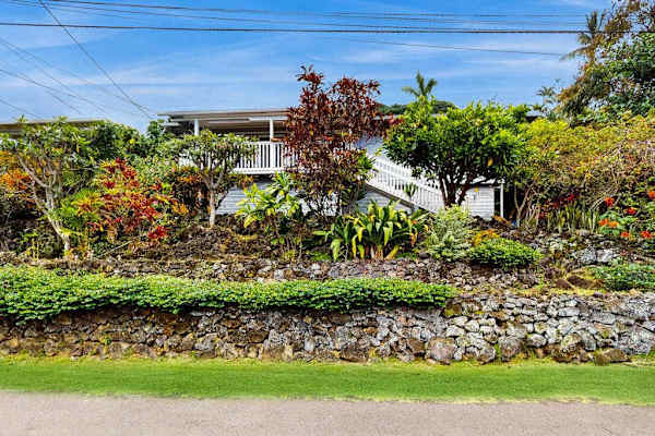 Landscaped exterior grounds surround the home with plants and pathways