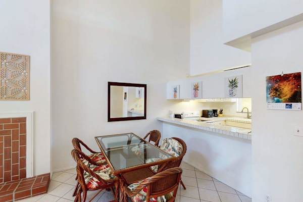 Dining room with a table for four, perfect for a game night or dinner in, after a long day.