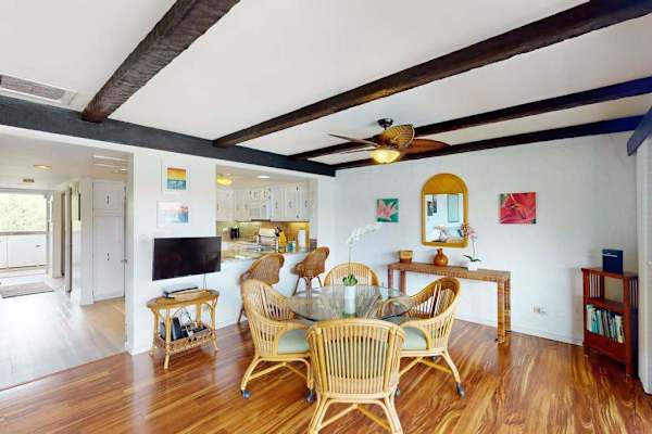 Dining Area View Showing Kitchen Bar & Vaulted Beamed Ceilings