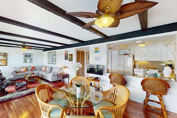 Spacious Open Living Area with Wicker Dining Set & Breakfast Bar