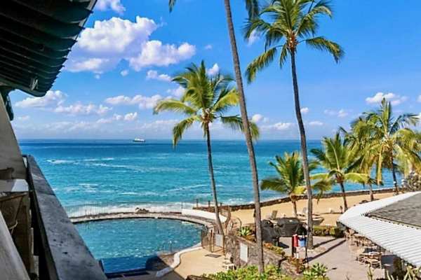 Pacific coastline views frame palm trees and blue island waters