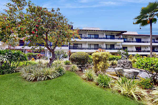 Charming stone exterior welcomes guests with grounds and island views