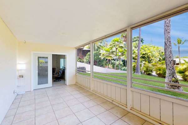 Spacious Screened Lanai with Yard & Palm Views