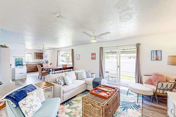 Living room with plenty of seating for relaxing on the sofa bed or a table for having a game night. 
