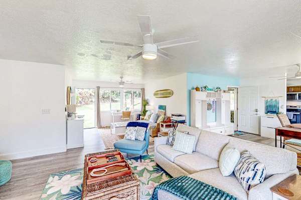 Living room with plenty of seating for relaxing on the sofa bed or a table for having a game night. 