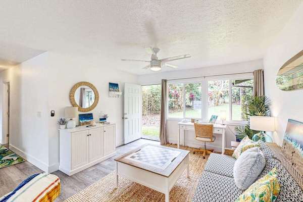 Living room with plenty of seating for relaxing on the sofa bed or a table for having a game night. 