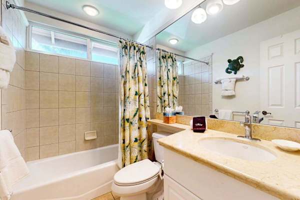Crisp Guest Bathroom Featuring Tub And Shower Combo