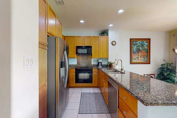 Fully stocked kitchen allowing the chef to prepare any meal.  Large countertop for extra prep space or for extra seating with the barstools for dining.