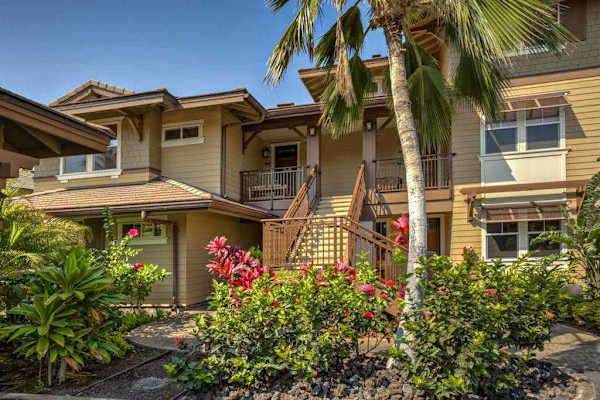 Front Exterior Entryway surrounded by Tropical Flowers & Palms