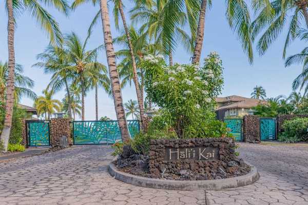 Gated Resort Entrance Sign for Hali'i Kai with Tropical Palm Trees