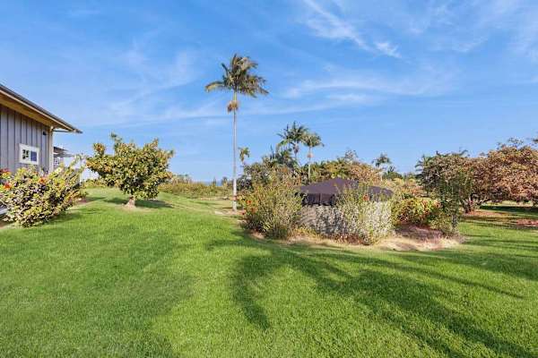 This exquisite one-bedroom apartment is nestled within a peaceful five-acre botanical estate, offering a serene retreat.