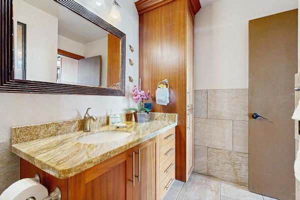 Spacious Warm Wood Vanities Offer Plentiful Storage Space
