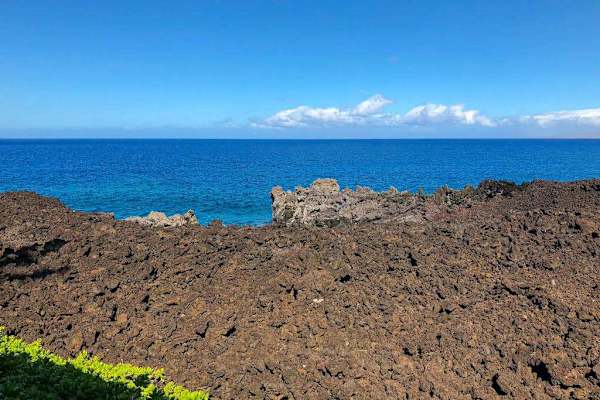 Striking Volcanic Formations Framing Pristine Coastline Waters