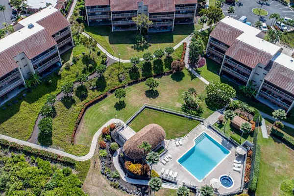 Aerial resort views reveal manicured grounds pool and tropical surroundings