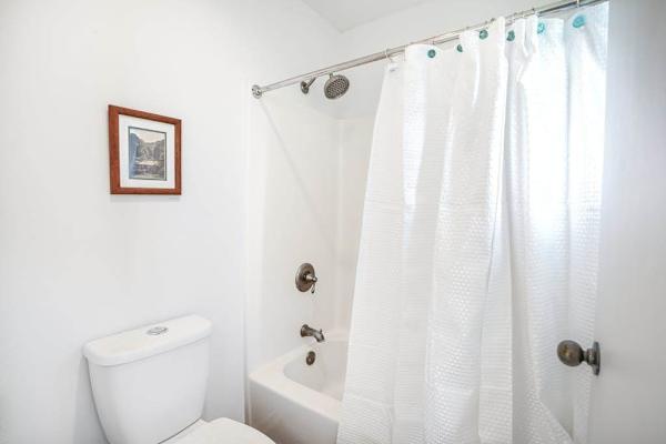 Spotless Bathroom With Shower And Tub