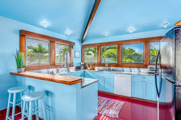 Spacious dining area within the kitchen offers coordinated seating beneath bright natural light