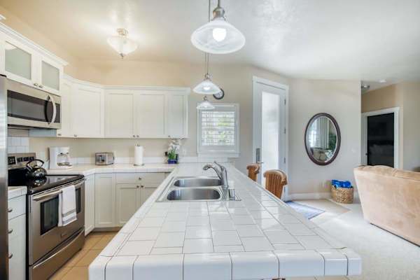 Bright Open-Concept Kitchen Leading to Living & Dining Areas