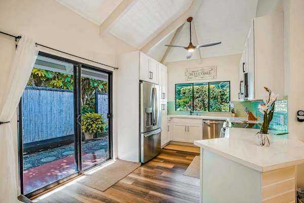 Kitchen with lots of light from the sliding doors leading to the lanai.