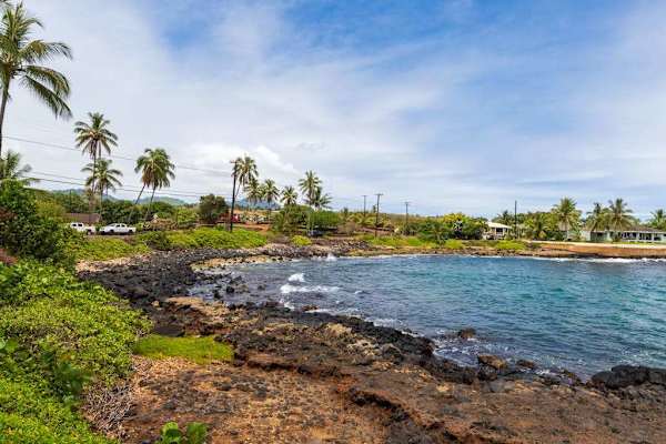 Rugged Lava Shoreline And Blue Waters