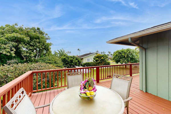 Step outside to the wraparound lanai, where lush tropical foliage creates a peaceful backdrop for morning coffee or evening conversation.