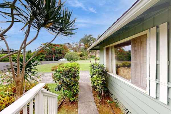 Lush tropical foliage surrounds this lovely home.