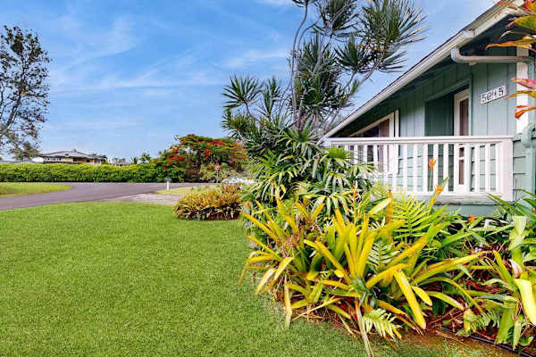 Lush tropical foliage surrounds this lovely home.