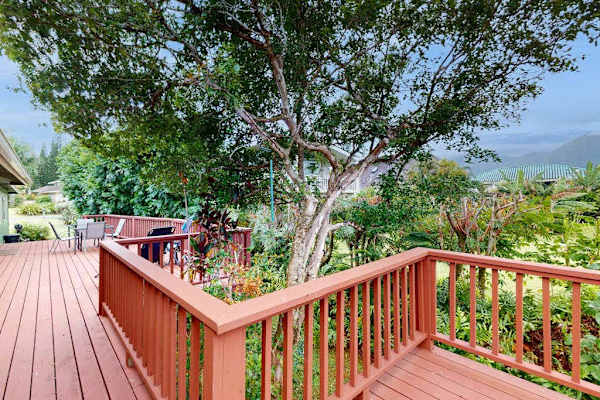 Step outside to the wraparound lanai, where lush tropical foliage creates a peaceful backdrop for morning coffee or evening conversation.