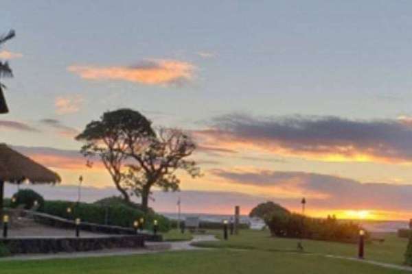 Golden Sunset Over The Tropical Resort Grounds