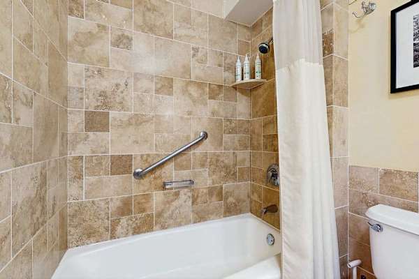 Beautiful Tiled Bathroom With Soaking Tub