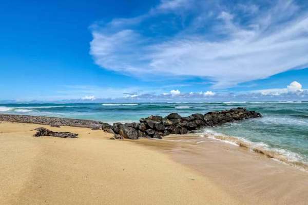Beachfront Shoreline with Calm Water & Rock Breakwater