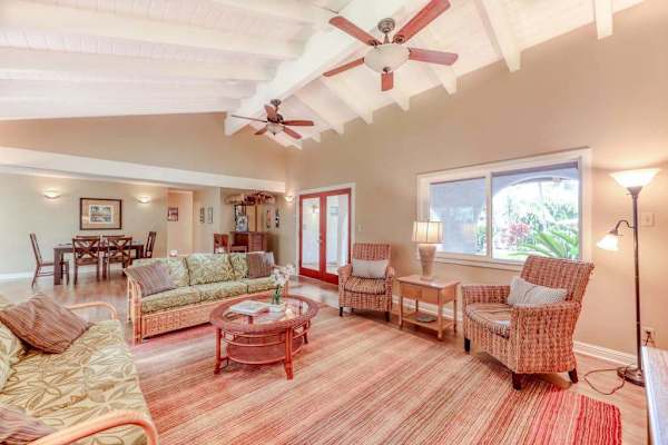 Sunlit Secondary Living Area with Wood-Beamed Ceilings