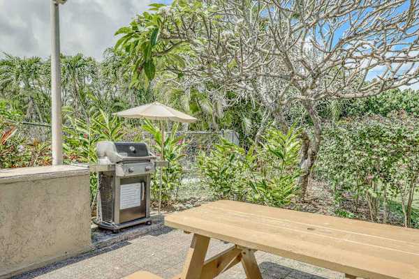 Barbecue Station with Gas Grill and Wooden Picnic Bench